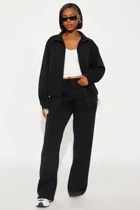 Detail of black women's tracksuit set with stand collar zipper jacket and drawstring pants