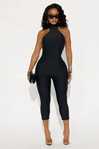 Close-up of black halter neck sleeveless jumpsuit in high-stretch knitted fabric