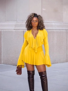 Chic yellow V-neck ruffle dress with flared long sleeves and matching leather boots