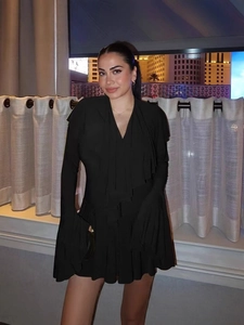 Elegant slim fit black V-neck dress with ruffle cuffs and hem for evening parties