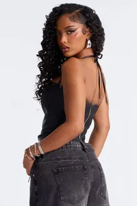 Detail view of black PU leather halter top featuring a secure metal back zipper closure