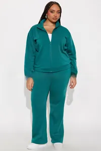 Close-up of women's dark green tracksuit featuring stand-up collar and full zipper jacket