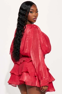 Detailed view of red French-style tiered satin mini dress with lace-up ruffled design