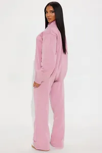 Side view of pink long sleeve sweatshirt and wide-leg joggers lounge set for women