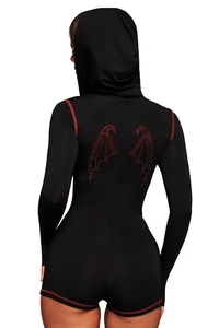 Detail view of the back showing a red beaded bat wing motif on a black hooded bodysuit