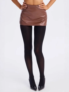 Chic black mini PU leather skirt with sheer tights and pointed heels on white backdrop