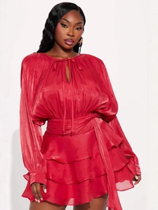 Elegant red tiered ruffle mini dress with long lantern sleeves and tie-neck details