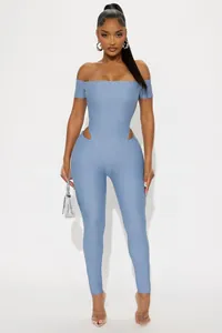 Close-up of light blue off-shoulder jumpsuit featuring waist cut-out details and short sleeves