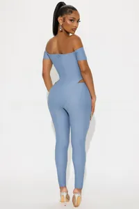 Detail of light blue off-shoulder jumpsuit featuring side waist cut-outs and slim fit design