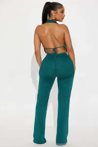 Detail of the backless halter top with criss-cross lace-up ties in dark green fabric