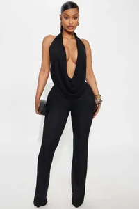 Close-up of black backless halter top with cowl neck and slim fit trousers set