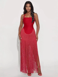 Sparkly red halter dress with tassels and high side slit shown in a front view pose