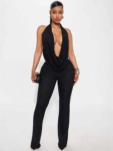 Sleek black halter neck jumpsuit with deep V-neckline and slim fit full-length trousers