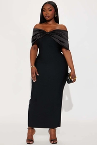 Close-up of elegant off-the-shoulder black maxi dress featuring a large satin bow detail