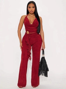 Elegant wine red halter neck jumpsuit with deep V-neck, metal ring cutout and wide leg pants