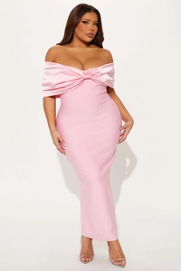 Detail of elegant pink off-shoulder gown with oversized satin bow on the chest
