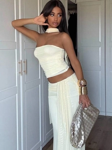 Chic cream pleated two-piece set featuring a tube crop top and matching maxi skirt for women