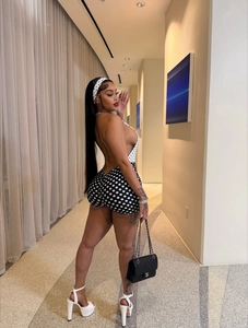 Sexy halter neck polka dot romper with open back design and slim fit silhouette