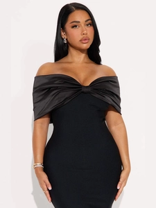Elegant black off-shoulder bodycon dress featuring a large satin bow and slim fit design