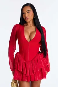 Macro detail of red deep V-neck dress with layered ruffles and sheer chiffon long sleeves