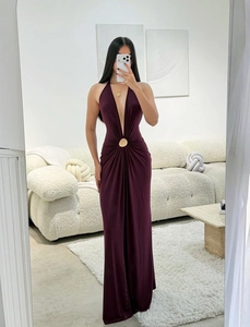 Detail of the deep V-neckline and elegant metal ring buckle on this purple evening gown