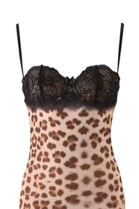 Detailed view of leopard print dress with delicate black floral lace and a small bow