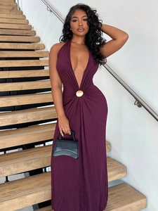 Detail of deep V-neck dark purple halter dress with a central golden metal ring