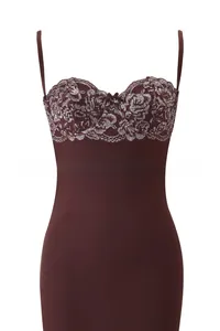 Detail of burgundy bodysuit featuring intricate floral lace trim and small bow detail