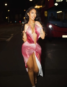 Detail of high side slit on pink gradient satin dress with contrasting white lining detail