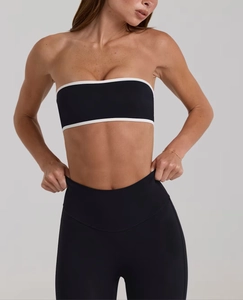 Detail of black sports tube top with white contrast piping and high elasticity fabric