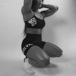 Black high-waist fitness set with wolf logo and Wolves text print in monochrome style