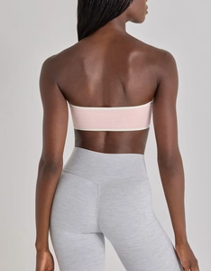 Detail view of pink and white contrast bandeau sports bra with high elastic back