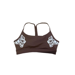 Detailed view of racerback sports bra with wolf head print and supportive wide hem
