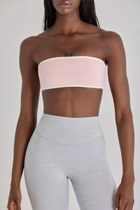 Detail of high-stretch sports bra and leggings set with contrast piping and marled fabric