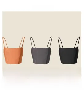 Detailed comparison of orange, dark grey, and black yoga sports bras with thin straps