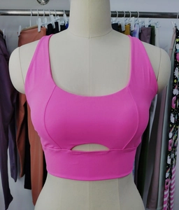 Close-up of pink high-impact sports bra featuring a stylish front oval cutout design
