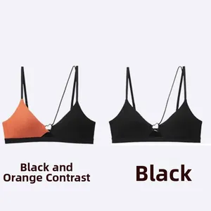 Detail of V-neck yoga tops with thin straps and heart-shaped metal connectors