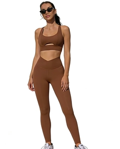 Close-up of chocolate brown yoga set featuring hollow-out bra and V-shape waistband