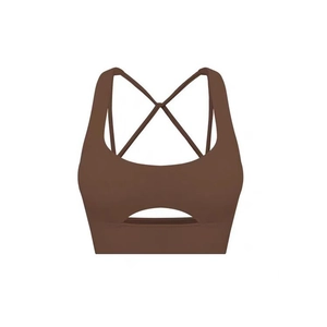 Brown high-stretch sports bra with crescent cutout and cross back straps on white background