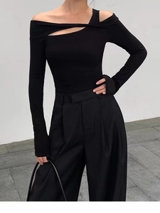 Women's black off-shoulder yoga top with asymmetric cutout and long sleeves for fitness