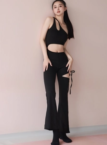 Detail showing the sexy one-shoulder cutout design and slim fit of this black jumpsuit