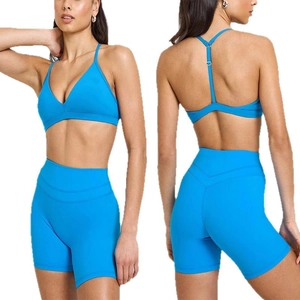 Two-piece bright blue yoga set featuring a V-neck sports bra and high-waist lifting shorts
