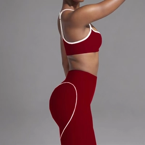 Detail of burgundy yoga set featuring heart-shaped stitching for a peach butt lift effect
