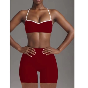 Women's dark red yoga set featuring V-neck sports bra and high-waist shorts for fitness