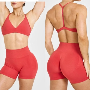 Women's red high-waist seamless sports bra and yoga shorts set for fitness and gym wear