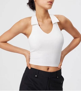 Detail of white polo-style yoga tank top with v-neck and high elasticity material