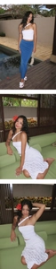 Detail of white one-shoulder crop top and resort style skirts by a pool setting