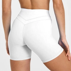 Close-up of white high-waisted yoga shorts with V-shaped stitching for booty lift effect