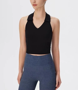 Close-up of black polo V-neck yoga vest with halter collar and high-stretch fabric