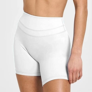 Detail shot of white high-waisted yoga shorts with reinforced triple stitching and wide waistband